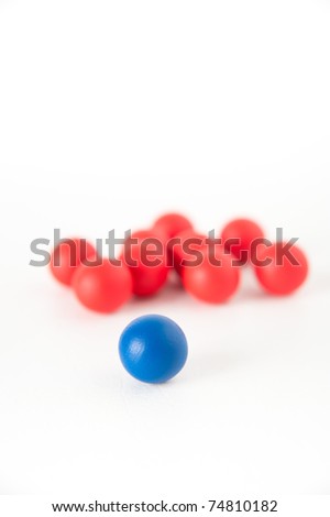 One Red Sphere with Lots of Red Ones Leadership Concept