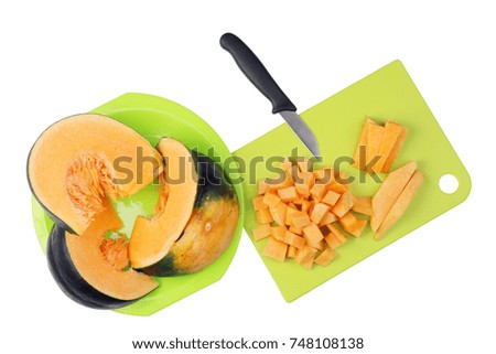 To cook a tasty vegetable soup pumpkin  must be finely chopped into small cubes. Isolated on white top view shot