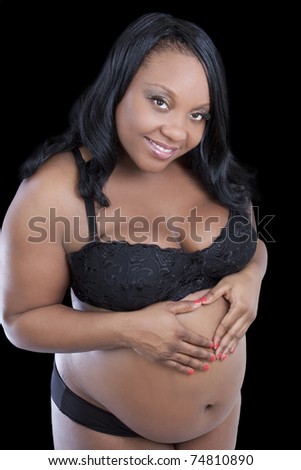 Young African American woman pregnant bra and panties