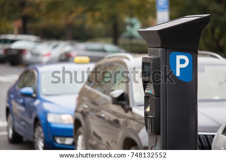 Parking machine with solar panel in the city street. Pay On Foot Parking System Royalty-Free Stock Photo #748132552