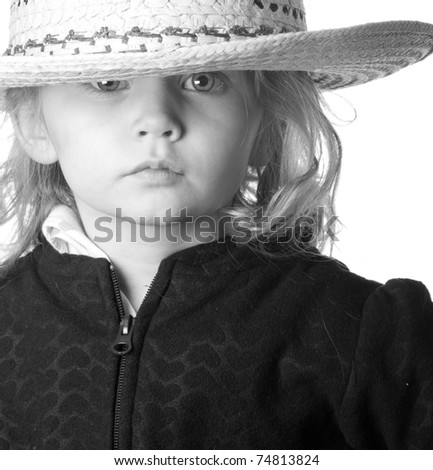 A cute but serious cowgirl is photographed using the rule of thirds.
