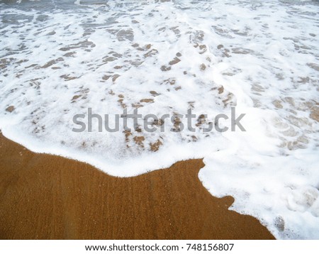 Soft wave of ocean on the sandy beach Sri Lanka