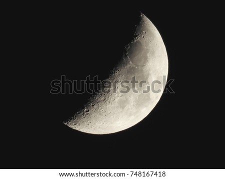 A waning Moon in a Night Sky