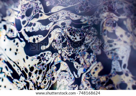 Beautiful psychedelic abstraction formed by light on the surface of a soap bubble.