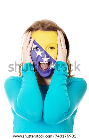 Bosnia and Herzegovina flag on woman's face.