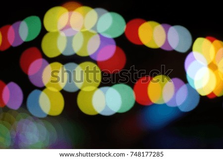 Colorful abstract bokeh in blurred background at night in the moment of Christmas and new year festival holiday event