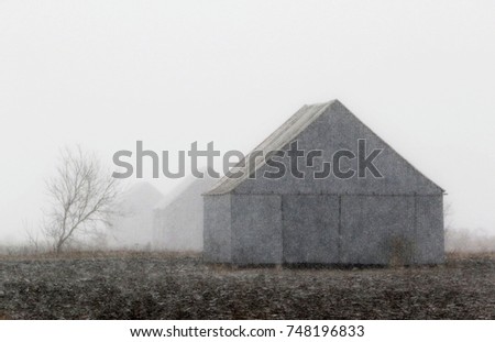 Three old wood barns in field under snowfall