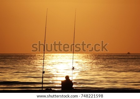 Person at the beach sunrise