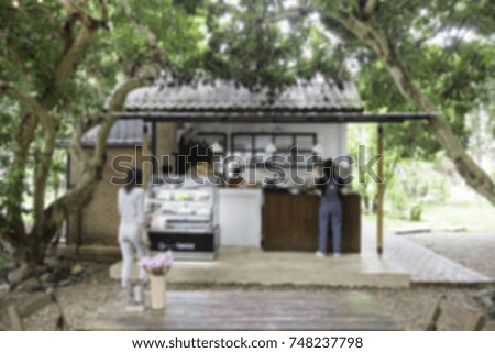 Blur image of Coffee shop in the garden.