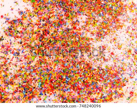 Abstract background of colorful shaving from pencil sharpener on white 