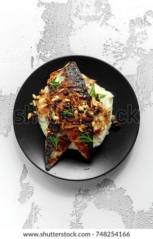 Sicilian style mackerel on cauliflower puree with caramelized onions, pine nuts