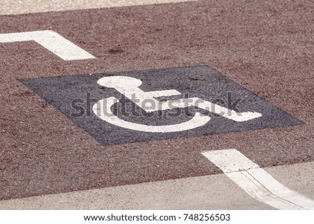 Way of wheel chair in the garden, disabled icon sign on the road in the public park