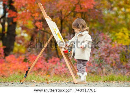 Autumn Baby Girl Drawing in Fall Leaves Park, Little Kid Painting, Children Creativity