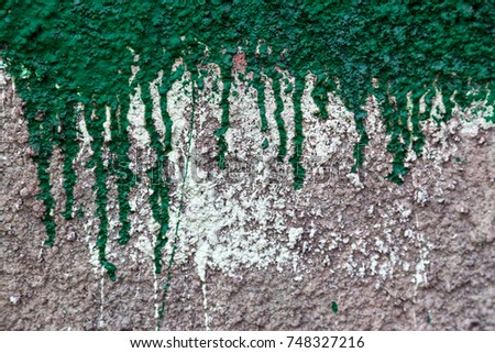 Old colorful wall plastered with traces of old paint, texture. As a vintage worn background for extraordinary creative design