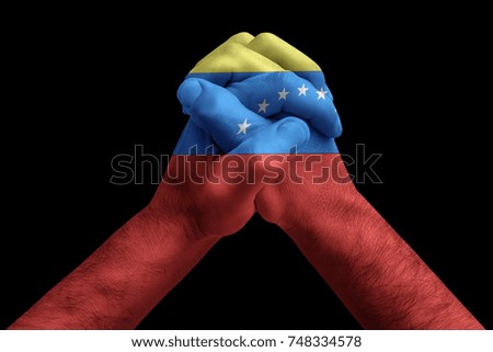 Fist painted in colors of Venezuela flag, fist flag, country of Venezuela