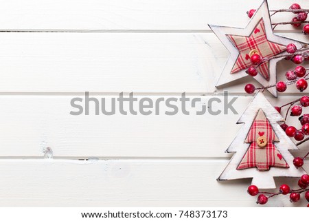 Christmas decor on the wooden white background.