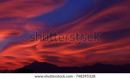 A fabulous and dramatic red sunset, the "dunes of fire" are due to a particular and rare phenomenon, which depends on humidity and air flows