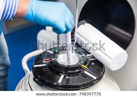 Liquid nitrogen cryogenic tank at life sciences laboratory Royalty-Free Stock Photo #748397770
