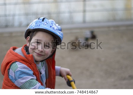 Portrait of boy on bike
