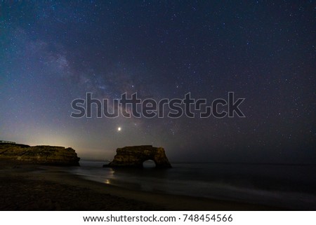 Milky way over natural bridges state beach, California