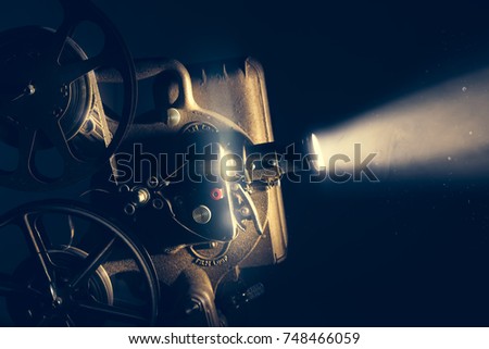 Film projector with dramatic lighting / high contrast image