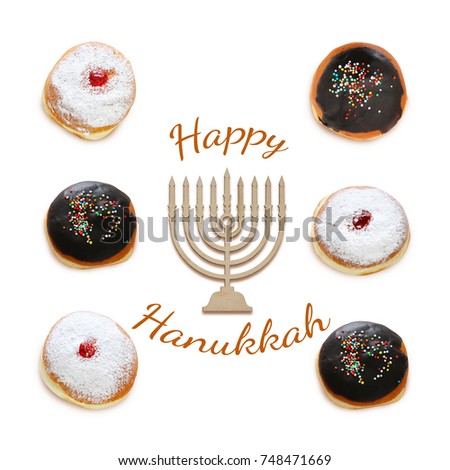 jewish holiday Hanukkah image with traditional doughnuts isolated and menorah (traditional candelabra) on white