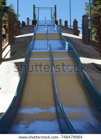 Giant bumpy metal slide. Royalty-Free Stock Photo #748478884
