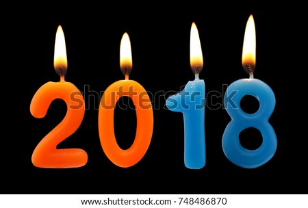 Burning candles on black background, number 2018, new year concept