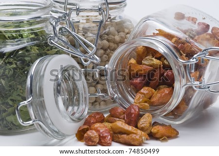 Some glass pots with differents spices.