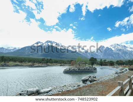 Amazing view of the Jade Dragon Snow Mountain with the pond, Lijiang-Yunnan, China.