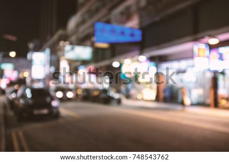 abstract blur and defocused Hong Kong street at night background, old film look effect