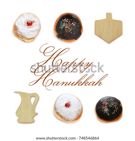 jewish holiday Hanukkah image with traditional doughnuts and spinning to isolated on white.