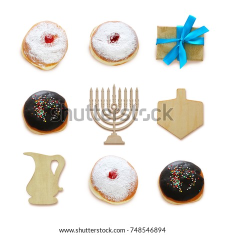 jewish holiday Hanukkah image with traditional doughnuts and menorah (traditional candelabra) isolated on white