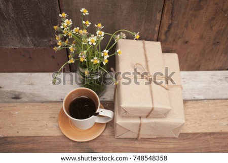 gift box and coffee cup on old wood background