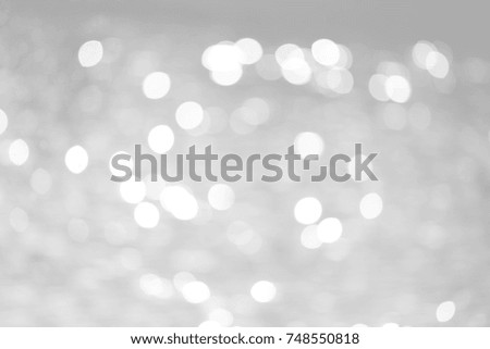 Grey bokeh with white color abstract background can be use as wallpaper, Christmas card background or new year card background. The background show light bokeh which on defocused light.