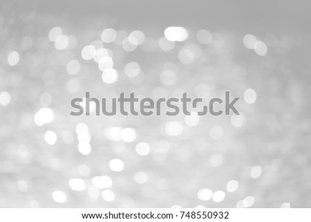 Grey bokeh with white color abstract background can be use as wallpaper, Christmas card background or new year card background. The background show light bokeh which on defocused light.
