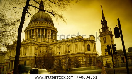 St Pauls Cathedral with light cars and red bus passing, LONDON, ENGLAND