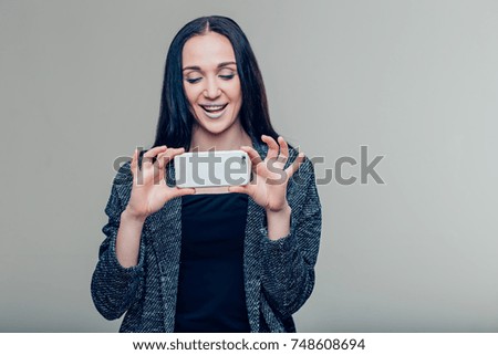 women making photo on mobile phone, female taking pictures with cell phone camera