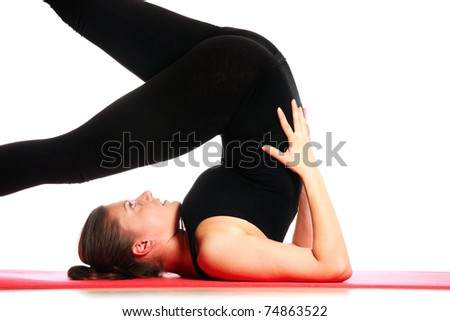 A picture of a young woman exercising on a mat over white background