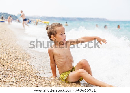 Beautiful boy and the sea