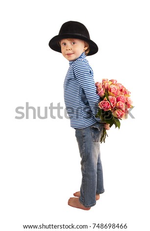 funny cute child with hidden bunch of roses on white background