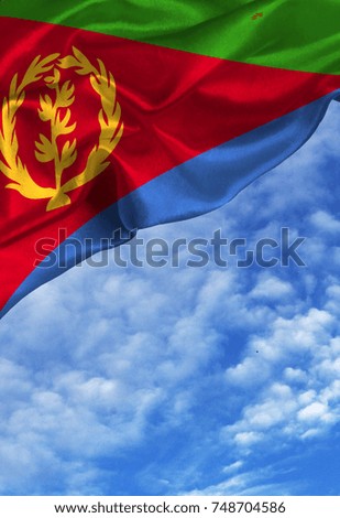 Grunge colorful flag Eritrea, with copyspace for your text or images against a blue sky with clouds