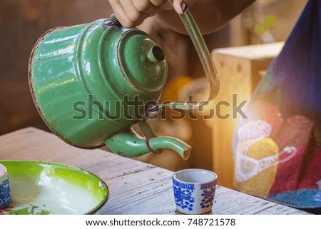 Pouring tea.