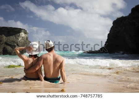 happy couple on the beach on Bermuda, summer holidays or honeymoon background