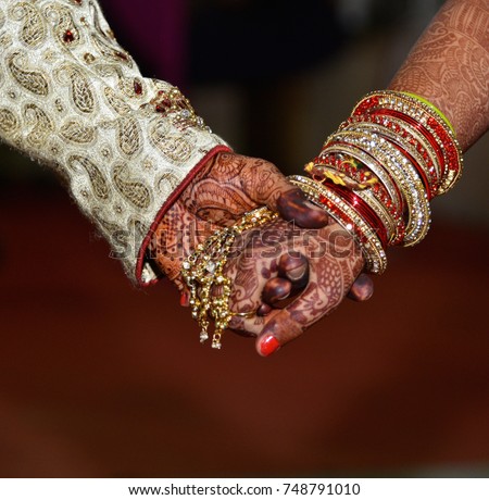 Hands of a couple in marriage.