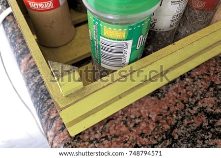 Spices stored in yellow wooden box
