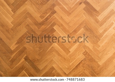 wooden floor background - herringbone parquet background - Royalty-Free Stock Photo #748871683