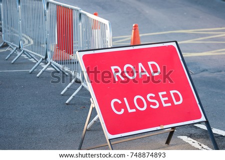 road closed sign with fence and bollard to prevent against terrorist attack causing traffic disruption