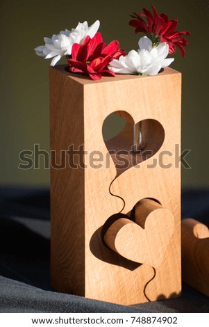 valentines day hearts and flowers in block of wood