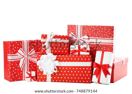 Red gift boxes with ribbon isolated on white